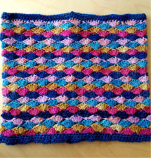 Solid crocheted cowl in several bright colors