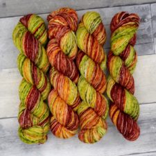 Variegated yarn in the greens, reds and golds of when fall leaves first start to change.