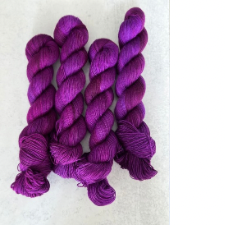 Deepest red violet semi-solid yarn.