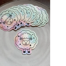 Iridescent stickers of sweet sheep with its eyes closed.